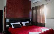 ห้องนอน 6 Vinodhara Guesthouse