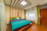 Kamar Tidur Colorful Flower Guesthouse