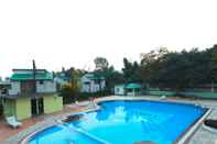 Swimming Pool Corbett Aamod Resort and Spa - Riverside Resort