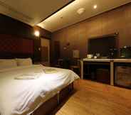 Kamar Tidur 7 CoCo Hotel