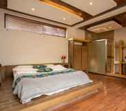 Bedroom 6 Yunzhong Baisha Lijiang Inn