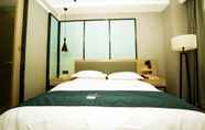 Bedroom 6 Echarm Hotel Qingyuan Stadium Branch