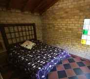 Bedroom 6 Bungalow-Cabañas en Albergue Valle Do Seo