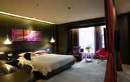 Kamar Tidur 3 Leshan Wow Hotel