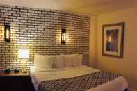 ห้องนอน Penn Lodge Hotel & Suites