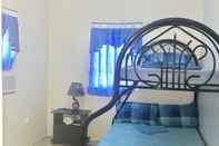Kamar Tidur Blue Summer Suites