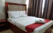 Kamar Tidur 6 Cherry Midtown Hotel