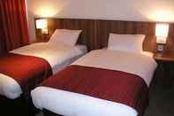 ห้องนอน Ramada by Wyndham Hounslow - Heathrow East