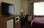 Bedroom 7 Travelodge by Wyndham Golden Sportsman Lodge