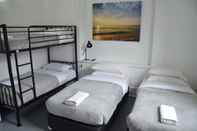 Kamar Tidur Sandy Bottoms Guesthouse