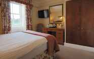 Kamar Tidur 4 The Royal Hotel