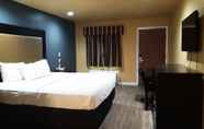 Bilik Tidur 3 Woodridge Inn and Suites