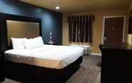 Kamar Tidur 4 Woodridge Inn and Suites