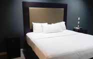 Kamar Tidur 7 Woodridge Inn and Suites