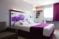 Bedroom Kyriad Montpellier Sud