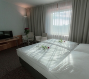 Bedroom 3 Cosmopolitan Bobycentrum – Czech Leading Hotels