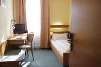 ห้องนอน City Hotel Würzburg