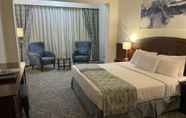 Bedroom 7 Triumph Plaza Hotel