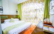 Kamar Tidur 5 Yijie Holiday Hotel Taierzhuang Old Town