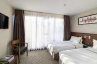 Bedroom Upsuites Hotel