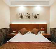 Kamar Tidur 6 Xitang Hotel