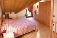 Phòng ngủ Appartamenti Enrosadira