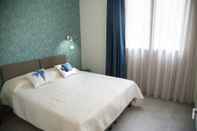 ห้องนอน Rivabella Suite Apartments