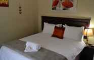 Kamar Tidur 5 The Oval Guesthouse