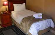 Kamar Tidur 7 The Oval Guesthouse