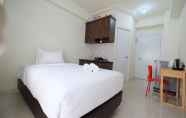 Bedroom 4 Comfy Studio Apartment @ Green Pramuka City