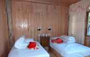 Phòng ngủ 6 Tengchong Ginkgo Village Bencai Hotel