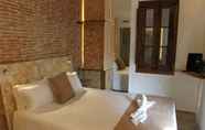 Kamar Tidur 6 Amfores Boutique Guest House