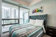 Bedroom Aaira Suites at 65 Bremner Blvd