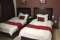 Bilik Tidur Fordsburg Inn Hotel