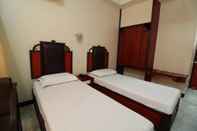ห้องนอน Hotel Naveen