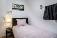 Kamar Tidur Rose House B&B