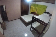 Bedroom Tauma Hostal & Camping