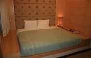 Kamar Tidur 3 Warm Life Hotel