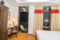 ห้องนอน Woodside Inn & Serviced Apartments