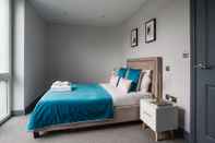 Bedroom Boutique Apartments by Flying Butler
