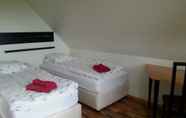 Kamar Tidur 5 Guesthouse Dalbaer