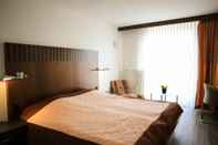 ห้องนอน Hotel Arina