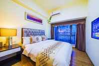 Kamar Tidur BaiHe International Apartment Hotel