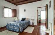 Bedroom 2 Rustic Holiday Home in the Natural Park