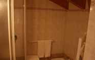 ห้องน้ำภายในห้อง 4 Dolomiti Hotel Olimpia