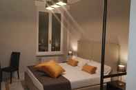 Kamar Tidur Compasso Suites