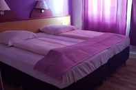 ห้องนอน Cara Vita Hotel