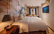 Kamar Tidur 3 Floral Hotel Liman Shenmiji Inn