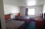 Bedroom 7 Carrington Inn & Suites
