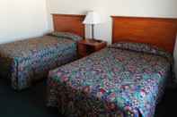 Kamar Tidur Carrington Inn & Suites